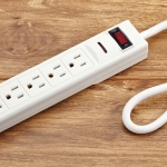 Why Some Power Strips Have A Reset Button (And When To Use It)